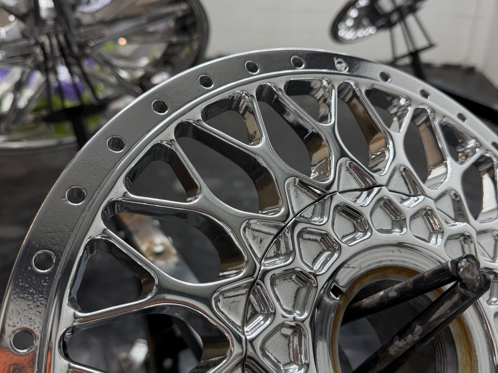 Mirror-polished mesh wheel with a riveted lip in the Wheel Polishing USA shop