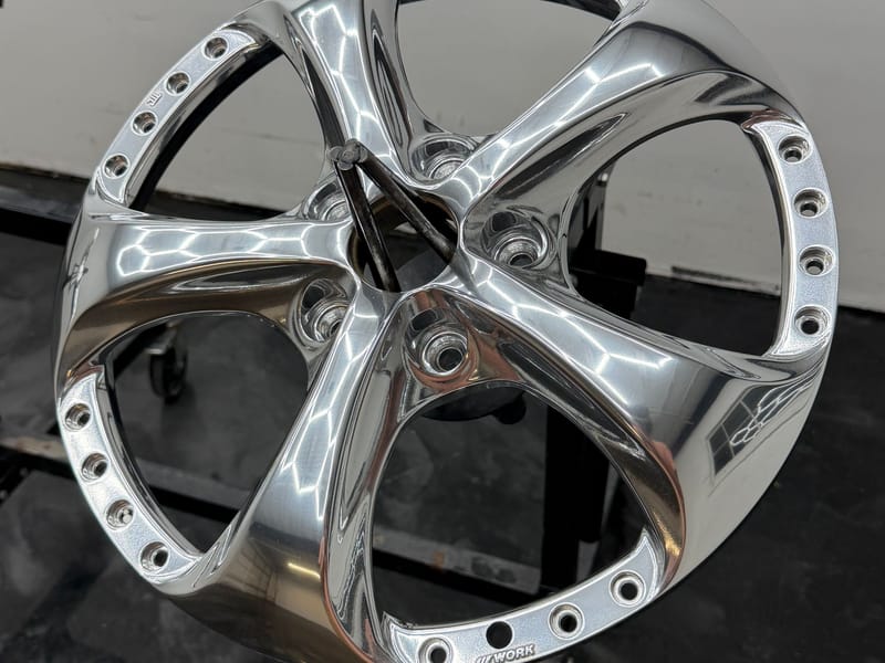 Mirror-polished multi-piece wheel center with bolt ring